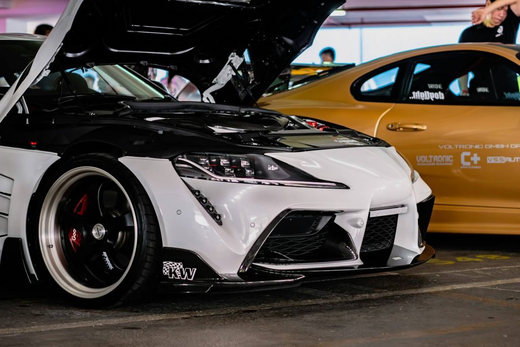 modified white supra with hood open